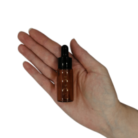 15ml Amber Glass Dropper Bottle in palm of hand